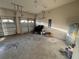 Spacious three car garage offers ample space for storage, featuring utility hookups and a water heater at 2715 Bartlet Dr, Kissimmee, FL 34741