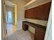 Home office features built in shelves, desk and tile flooring leading to the back patio at 2715 Bartlet Dr, Kissimmee, FL 34741