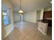 Kitchen and Gathering room with tile floors, natural light, and open layout to the outdoor pool area at 2715 Bartlet Dr, Kissimmee, FL 34741