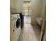 The laundry room features a washer, dryer, utility sink, and access to the two-car garage at 2715 Bartlet Dr, Kissimmee, FL 34741