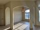 Inviting room showcasing arched doorways, chair rail, and ample natural light at 2715 Bartlet Dr, Kissimmee, FL 34741