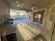 This covered outdoor patio kitchen includes a grill, sink and plenty of counter space at 2715 Bartlet Dr, Kissimmee, FL 34741