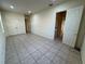 Spacious room with tile flooring, offering ample space, and featuring an open layout for versatile use at 2715 Bartlet Dr, Kissimmee, FL 34741