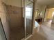 Spacious glass door shower with a shower head and toiletry dispensers at 2715 Bartlet Dr, Kissimmee, FL 34741