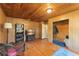 This spacious bedroom boasts wood floors and walls, with lots of space for storage and entertainment at 290 Pine St, Ormond Beach, FL 32174