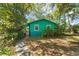 Charming single-story home features lush landscaping and a welcoming walkway at 290 Pine St, Ormond Beach, FL 32174