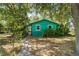 Charming single-story home features lush landscaping and a welcoming walkway at 290 Pine St, Ormond Beach, FL 32174