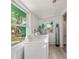Bright laundry area with ample natural light, featuring a washer and dryer at 290 Pine St, Ormond Beach, FL 32174