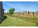 Expansive backyard with lush green grass and a sleek black fence, perfect for outdoor enjoyment at 3053 Brook Stone Ter, Davenport, FL 33837