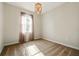 Bedroom featuring neutral walls and carpet, a window, and a chandelier at 3053 Brook Stone Ter, Davenport, FL 33837