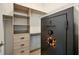 Walk-in closet with custom built-in storage and large Browning safe for secure valuable storage at 3053 Brook Stone Ter, Davenport, FL 33837