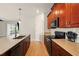 Well lit kitchen featuring stainless steel appliances, granite countertops and an open design to the living area at 3053 Brook Stone Ter, Davenport, FL 33837