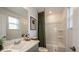 Bathroom featuring a tub and shower combination with a decorative patterned shower curtain at 3133 Skyline Loop, Kissimmee, FL 34758