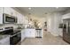 Spacious kitchen featuring stainless steel appliances, granite countertops, and an open layout to the living areas at 3133 Skyline Loop, Kissimmee, FL 34758
