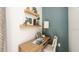 Bright office nook with floating shelves, contemporary desk, and ample natural light at 3133 Skyline Loop, Kissimmee, FL 34758