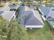 An aerial view of the property showing landscaping and pool at 4087 Clock Tower Dr, Port Orange, FL 32129