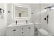 Modern bathroom with a double sink vanity, illuminated mirror, and a walk-in shower at 4087 Clock Tower Dr, Port Orange, FL 32129