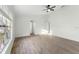 Bright bedroom features wood flooring and a large window at 4087 Clock Tower Dr, Port Orange, FL 32129
