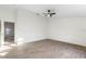 Large bedroom featuring wood-look floors, a ceiling fan, and an open doorway at 4087 Clock Tower Dr, Port Orange, FL 32129