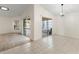 Open concept dining area showing sliding glass doors to the screened in lanai and pool at 4087 Clock Tower Dr, Port Orange, FL 32129