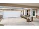 Attached garage and covered driveway feature a brick base and white door at 4087 Clock Tower Dr, Port Orange, FL 32129