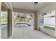 View of the pool from screened lanai and covered patio, perfect for relaxing at 4087 Clock Tower Dr, Port Orange, FL 32129