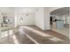 This is a large living space with an attached kitchen and multiple archways at 4087 Clock Tower Dr, Port Orange, FL 32129