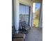 Balcony with outdoor seating overlooking a serene lake view at 459 Hamptoncrest Cir # 203, Lake Mary, FL 32746