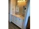 Bright bathroom featuring double sinks, modern fixtures, and a large mirror at 459 Hamptoncrest Cir # 203, Lake Mary, FL 32746