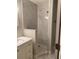 Modern bathroom featuring a white marble-tiled shower with glass doors and a vanity at 459 Hamptoncrest Cir # 203, Lake Mary, FL 32746