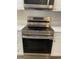 The modern oven boasts stainless steel finish and smooth stovetop at 459 Hamptoncrest Cir # 203, Lake Mary, FL 32746