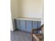 Exterior storage area with blue cabinets and a white countertop at 459 Hamptoncrest Cir # 203, Lake Mary, FL 32746