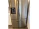 The stainless steel refrigerator adds a modern look to the kitchen at 459 Hamptoncrest Cir # 203, Lake Mary, FL 32746