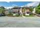 Inviting exterior view of the multi-Gathering property, enhanced by lush landscaping and mature trees at 4616 Tower Pine Rd # 4616, Orlando, FL 32839
