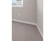 Neutral bedroom showcases carpeted flooring, baseboards, and window at 4827 Lacewing Dr, Winter Garden, FL 34787
