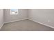 Bright bedroom with carpet flooring, white baseboards, and natural light at 4827 Lacewing Dr, Winter Garden, FL 34787