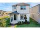 Charming two-story home with a welcoming porch and well-manicured landscaping at 4827 Lacewing Dr, Winter Garden, FL 34787