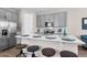 Well-equipped kitchen featuring stainless steel appliances and a breakfast bar with seating at 4827 Lacewing Dr, Winter Garden, FL 34787