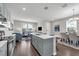 Spacious kitchen island adjoins the living and dining rooms in an open floor plan at 4827 Lacewing Dr, Winter Garden, FL 34787