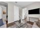 Bright living room featuring modern decor, hardwood floors, and a neutral color palette at 4827 Lacewing Dr, Winter Garden, FL 34787