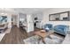 Open-concept living space featuring modern decor and seamless flow to the kitchen at 4827 Lacewing Dr, Winter Garden, FL 34787