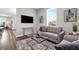 Comfortable living room offers modern decor, a large window, and a relaxing atmosphere at 4827 Lacewing Dr, Winter Garden, FL 34787