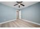 This bedroom features a ceiling fan and neutral walls. The closet offers ample space to organize personal belongings at 5 Redwood Trace Run, Ocala, FL 34472