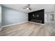 Spacious living room with contemporary flooring, ceiling fan, and a modern accent wall, perfect for entertaining or relaxing at 5 Redwood Trace Run, Ocala, FL 34472