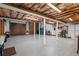 Spacious unfinished basement with painted floor, exposed ceiling, and ample storage space at 525 Sheridan Blvd, Orlando, FL 32804