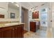 Bathroom featuring dual vanities, granite countertops, and a stained glass window at 525 Sheridan Blvd, Orlando, FL 32804