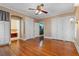 Spacious bedroom featuring hardwood floors, built-in storage, and an ensuite bathroom entrance at 525 Sheridan Blvd, Orlando, FL 32804