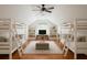 Spacious bedroom features vaulted ceilings, built-in shelves, two sets of bunk beds and hardwood floors at 525 Sheridan Blvd, Orlando, FL 32804