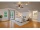Bright and spacious bedroom featuring a vaulted ceiling, hardwood floors, and access to a bathroom at 525 Sheridan Blvd, Orlando, FL 32804