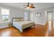 Comfortable bedroom with hardwood floors, neutral walls, and natural light at 525 Sheridan Blvd, Orlando, FL 32804